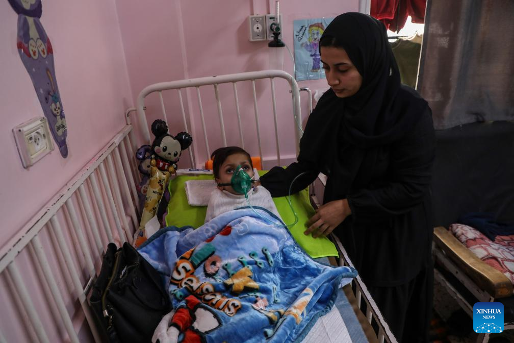 A Palestinian child receives treatment at Nasser Medical Complex in Khan Younis, southern Gaza Strip, on Dec. 1, 2025, while awaiting Israeli permission to travel abroad for critical medical care. (Photo by Rizek Abdeljawad/Xinhua)