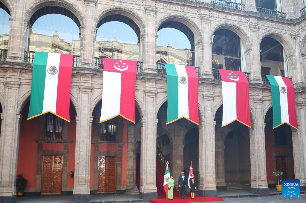 Mexican President Claudia Sheinbaum (R) hosts a welcome ceremony for visiting Singaporean President Tharman Shanmugaratnam (C) at the National Palace in Mexico City, Mexico, on Dec. 1, 2025. (Photo by Francisco Canedo/Xinhua)