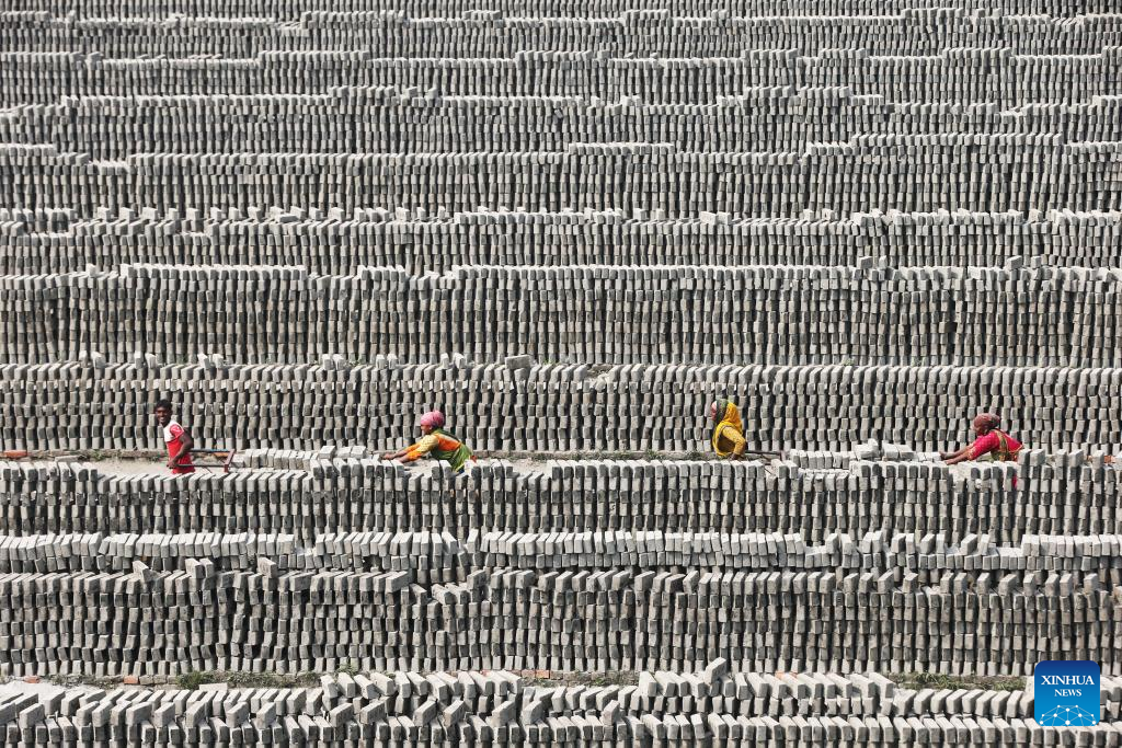 People work at a brick field in Dhaka, Bangladesh on Dec. 1, 2025. (Photo by Habibur Rahman/Xinhua)