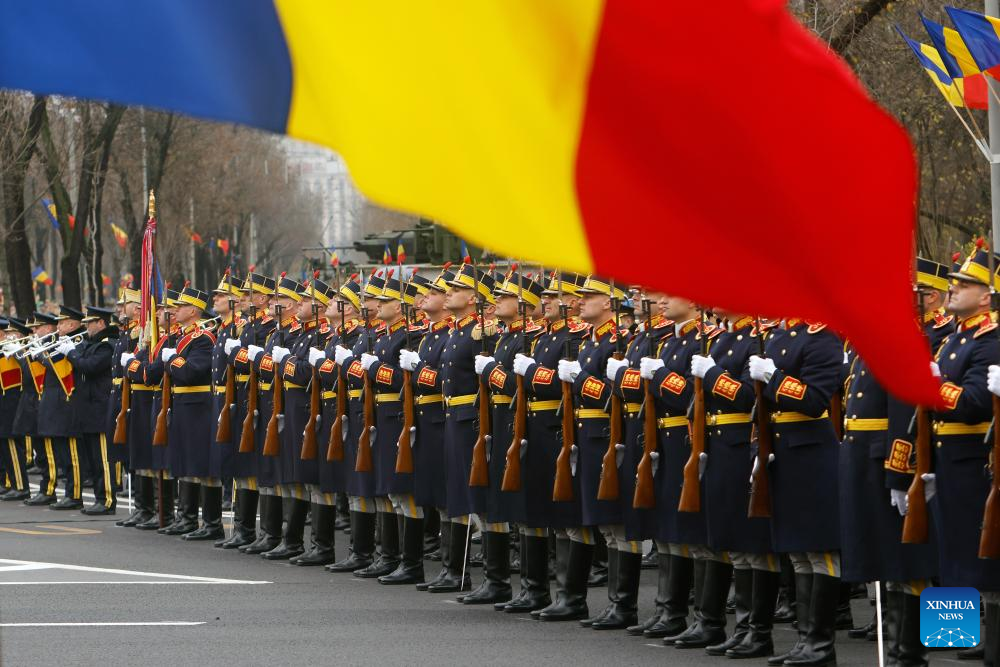 Soldiers attend a military parade celebrating Romania's National Day in Bucharest, Romania, on Dec. 1, 2025. (Photo by Cristian Cristel/Xinhua)