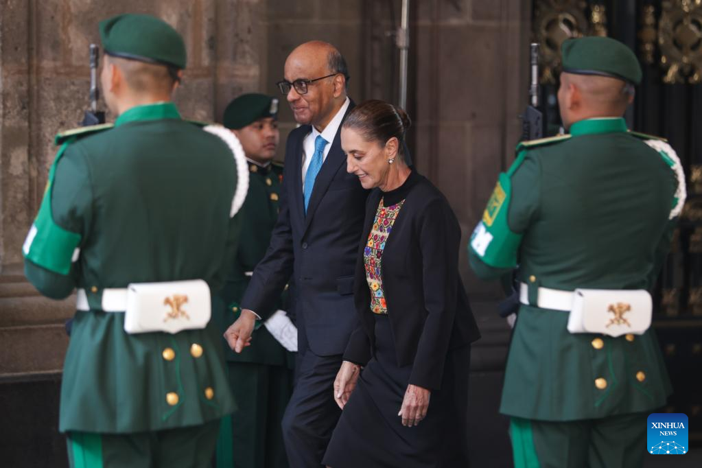 Mexican President Claudia Sheinbaum (R) hosts a welcome ceremony for visiting Singaporean President Tharman Shanmugaratnam at the National Palace in Mexico City, Mexico, on Dec. 1, 2025. (Photo by Francisco Canedo/Xinhua)