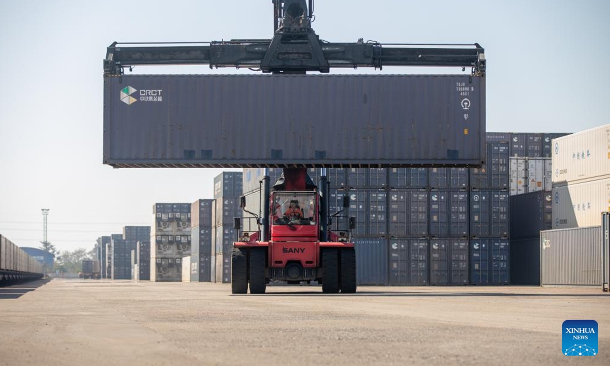 Workers conduct container hoisting operations at the Vientiane South Station on the China-Laos Railway in Vientiane, capital of Laos, Nov. 29, 2025. (Photo by Kaikeo Saiyasane/Xinhua)