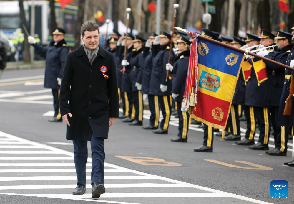 Romanian President Nicusor Dan attends a military parade celebrating Romania's National Day in Bucharest, Romania, on Dec. 1, 2025. (Photo by Cristian Cristel/Xinhua)