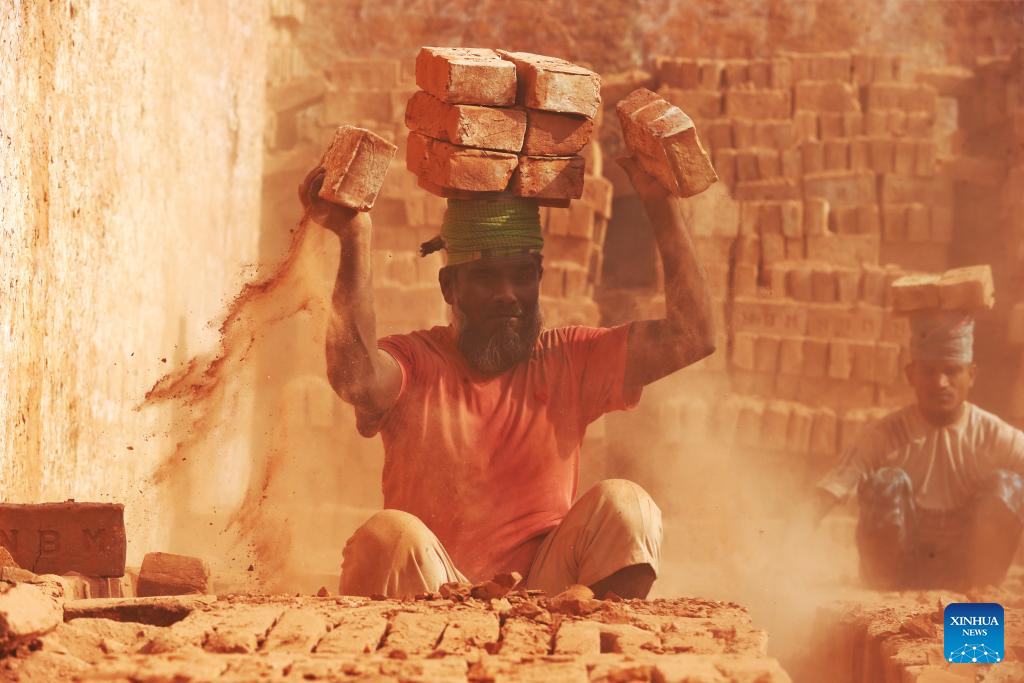 People work at a brick field in Dhaka, Bangladesh on Dec. 1, 2025. (Photo by Habibur Rahman/Xinhua)