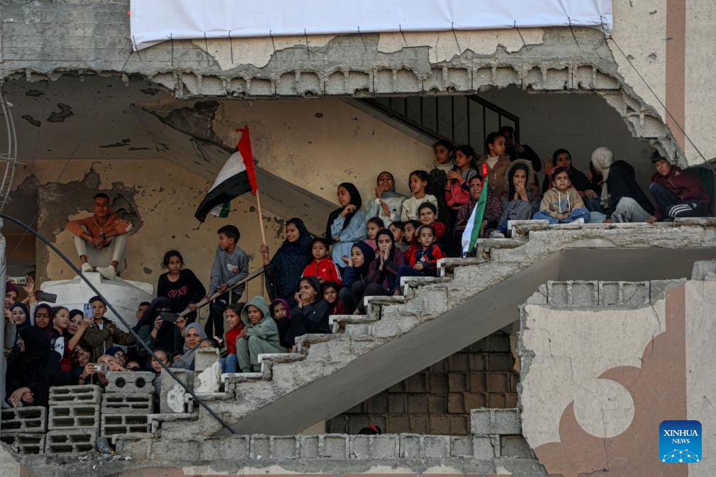 People watch a Palestinian mass wedding in the southern Gaza Strip city of Khan Younis, Dec. 2, 2025. Fifty-four couples attended the event. (Photo by Rizek Abdeljawad/Xinhua)