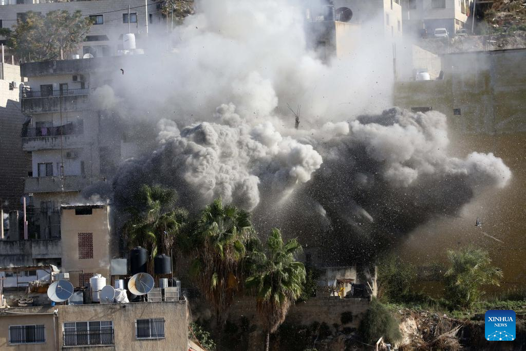 Smoke rises as Israeli forces blow up a Palestinian house in the West Bank city of Nablus, Dec. 2, 2025. (Photo by Nidal Eshtayeh/Xinhua)