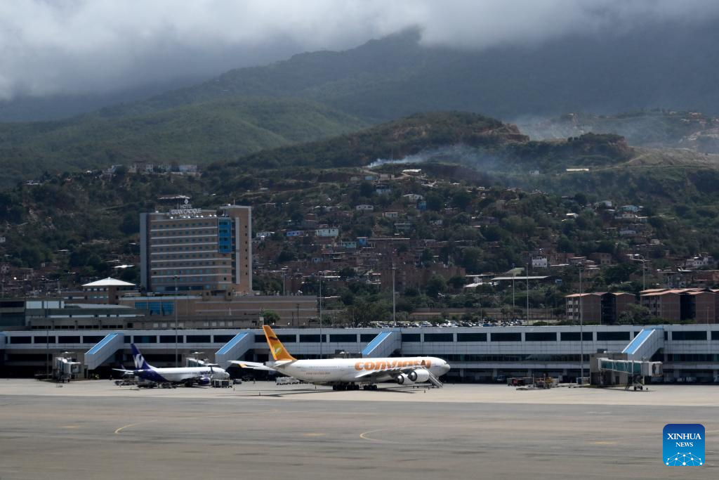 Passenger aircraft are pictured at the Simon Bolivar International Airport in Maiquetia, Venezuela, Dec. 1, 2025. (Xinhua/Li Muzi)