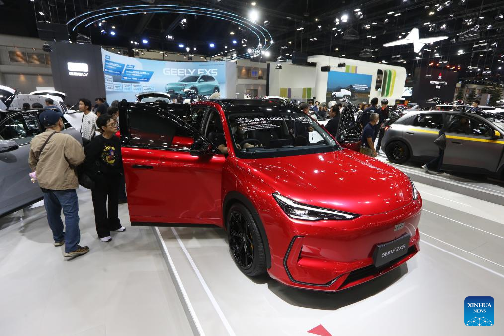 People visit the booth of Chinese carmaker Geely at the 42nd Thailand International Motor Expo in Bangkok, Thailand, Dec. 2, 2025. (Xinhua/Rachen Sageamsak)