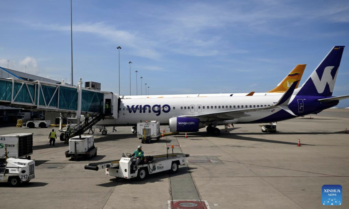 Passenger aircraft are pictured at the Simon Bolivar International Airport in Maiquetia, Venezuela, Dec. 1, 2025. (Xinhua/Li Muzi)