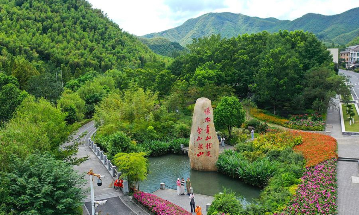An aerial drone photo taken on Aug. 6, 2025 shows tourists visiting Yucun Village in Anji County of Huzhou City, east China's Zhejiang Province. (Xinhua/Mao Zhu)