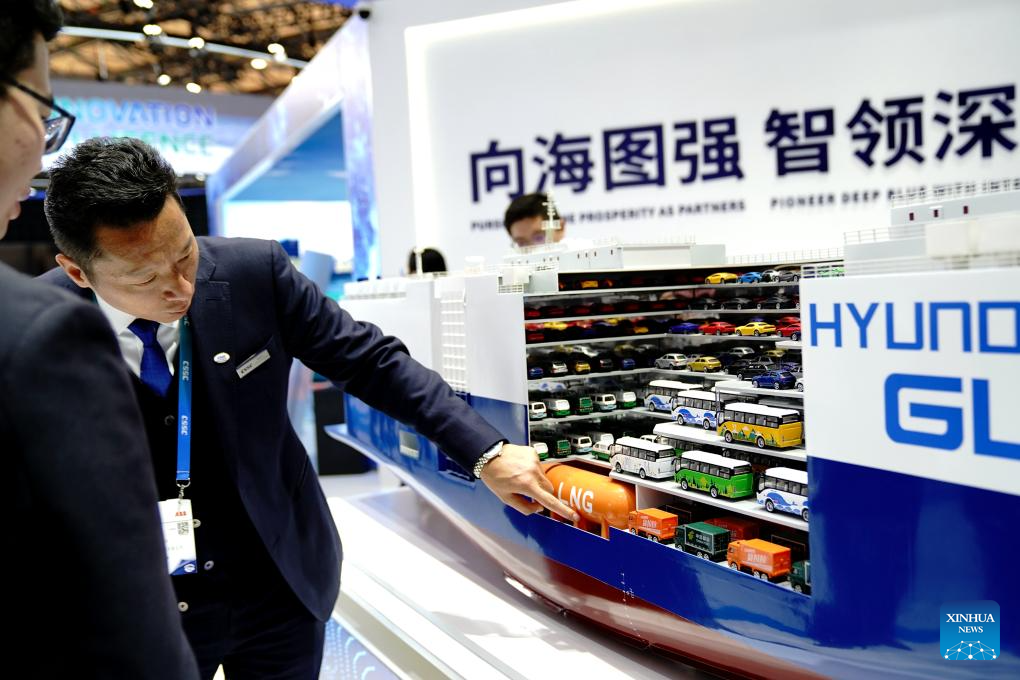 An exhibitor introduces a vehicle transportation vessel at an exhibition of the Marintec China 2025 at Shanghai New International Expo Center in Shanghai, east China, Dec. 2, 2025. Attracting over 2,200 enterprises from 16 countries and regions, the event kicked off here on Tuesday and will last until Dec. 5, 2025. (Xinhua/Zhang Jiansong)