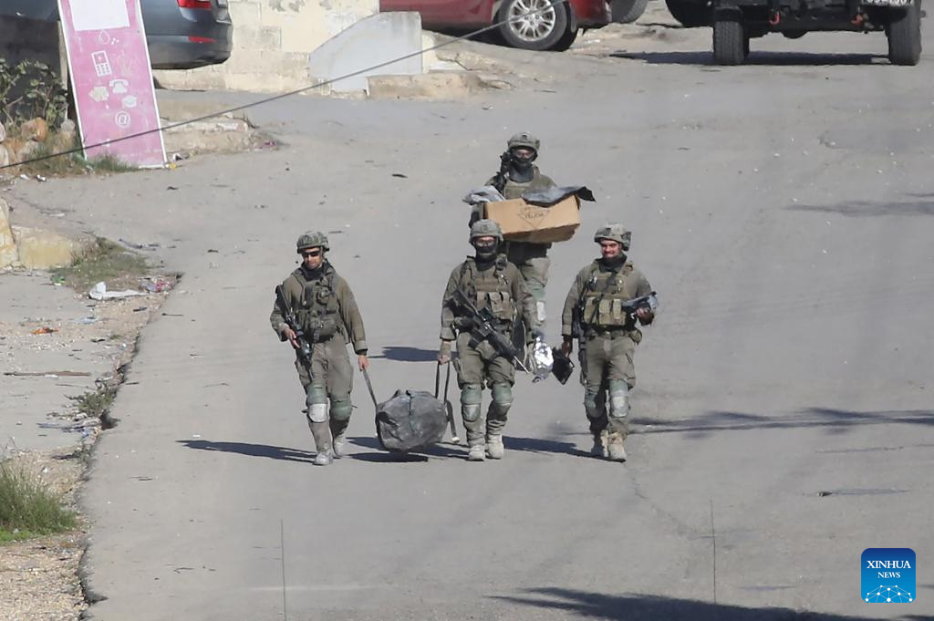Israeli forces are seen during a military raid in the West Bank city of Nablus, Dec. 2, 2025. (Photo by Nidal Eshtayeh/Xinhua)
