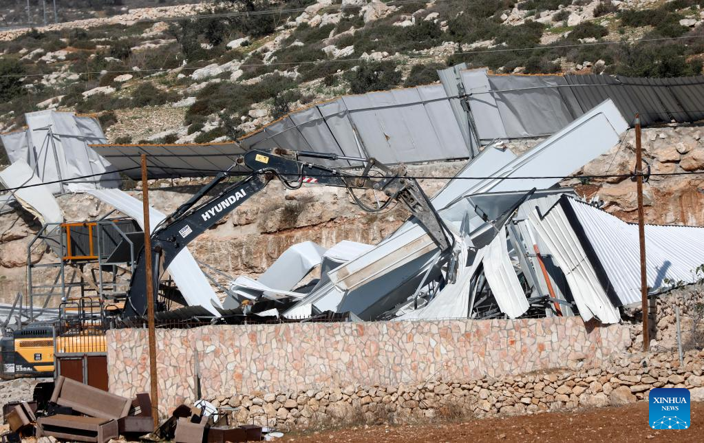 Israeli military bulldozer demolishes a facility in Beit Oula town northwest of Hebron in the West Bank, on Dec. 3, 2025. (Photo by Mamoun Wazwaz/Xinhua)