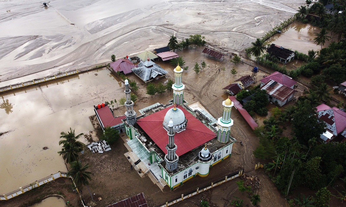 A drone image shows a mud-covered area at a flood-affected village in the Meureudu area of Pidie Jaya, Aceh, Indonesia on December 3, 2025. According to the National Disaster Management Agency, floods and landslides triggered by Tropical Cyclone Senyar have killed more than 750 people across Aceh, North Sumatra, and West Sumatra provinces. Photo: VCG