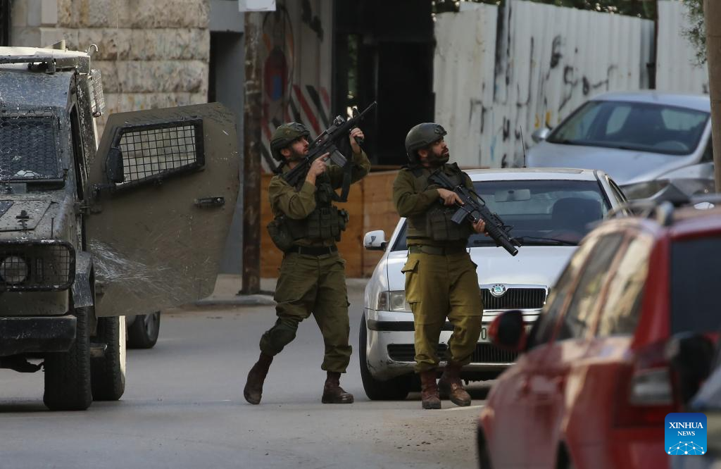 Israeli soldiers participate in a military operation in the West Bank city of Nablus on Dec. 3, 2025. Israeli forces stormed several neighborhoods at dawn in a new raid. (Photo by Nidal Eshtayeh/Xinhua)