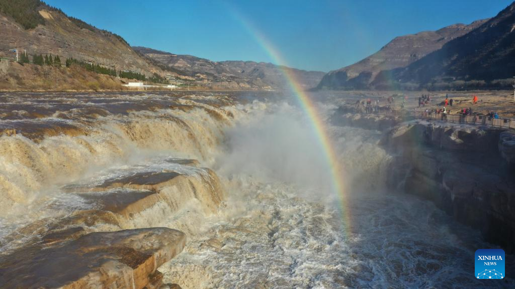 A drone photo taken on Dec. 3, 2025 shows a double rainbow over the Hukou Waterfall in Jixian County, north China's Shanxi Province. (Photo by Lyu Guiming/Xinhua)