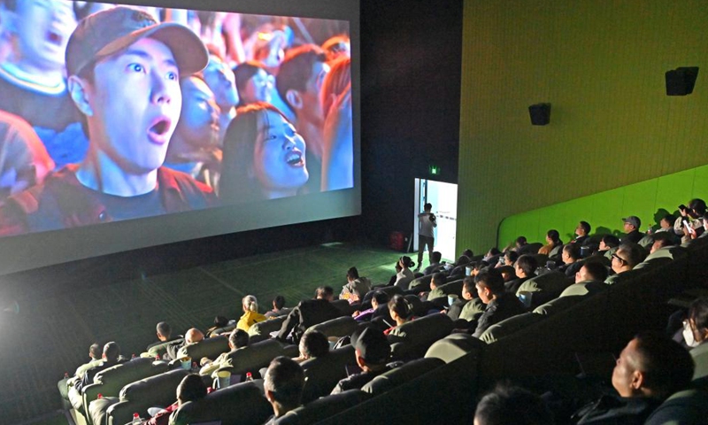 Visually-impaired people, together with their family members and volunteers, enjoy a movie at a cinema in Nanning, south China's Guangxi Zhuang Autonomous Region, Dec. 3, 2025. (Xinhua/Zhou Hua)