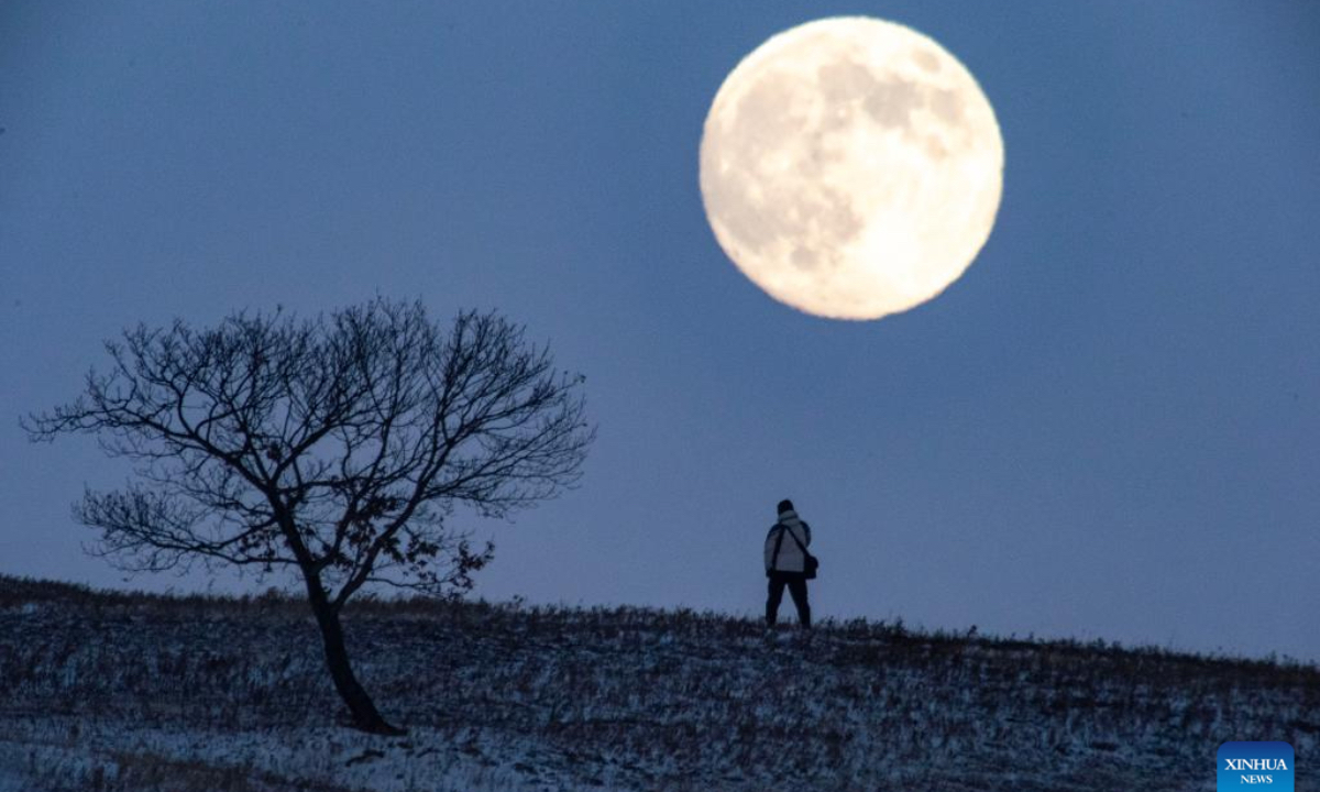 A full moon is pictured in Fujin City, northeast China's Heilongjiang Province, Dec. 4, 2025 This year's second-largest full moon to the eyes of lunar observers will appear on Friday morning, but the best viewing time falls on Thursday evening. (Photo by Qu Yubao/Xinhua)