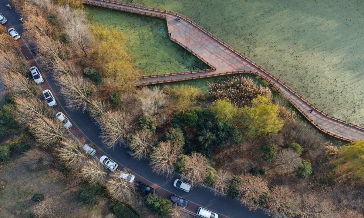An aerial drone photo taken on Dec. 6, 2025 shows a view of urban circular watercourse in Wenxian County, Jiaozuo City of central China's Henan Province. (Photo by Xu Hongxing/Xinhua)