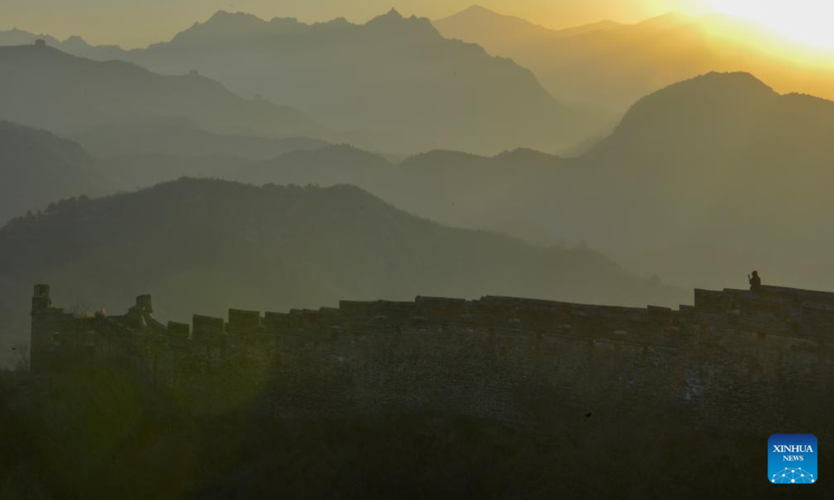 A visitor is seen on the Jinshanling section of the Great Wall in Luanping County, Chengde City of north China's Hebei Province, Dec. 6, 2025. (Photo by Zhou Wanping/Xinhua)