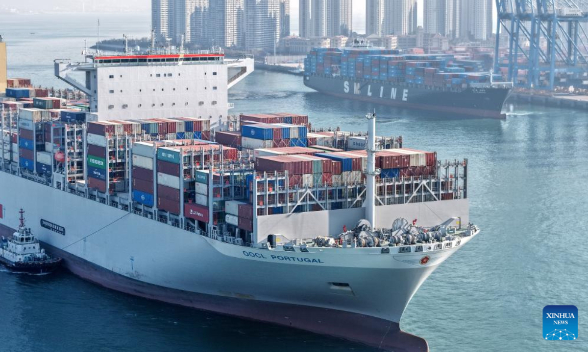 A drone photo taken on Dec. 4, 2025 shows cargo ships entering and departing from the Qianwan Container Terminal of Qingdao Port in east China's Shandong Province. With nearly 240 foreign trade routes, Qingdao Port connects over 700 ports in more than 180 countries and regions worldwide. (Xinhua/Li Ziheng)