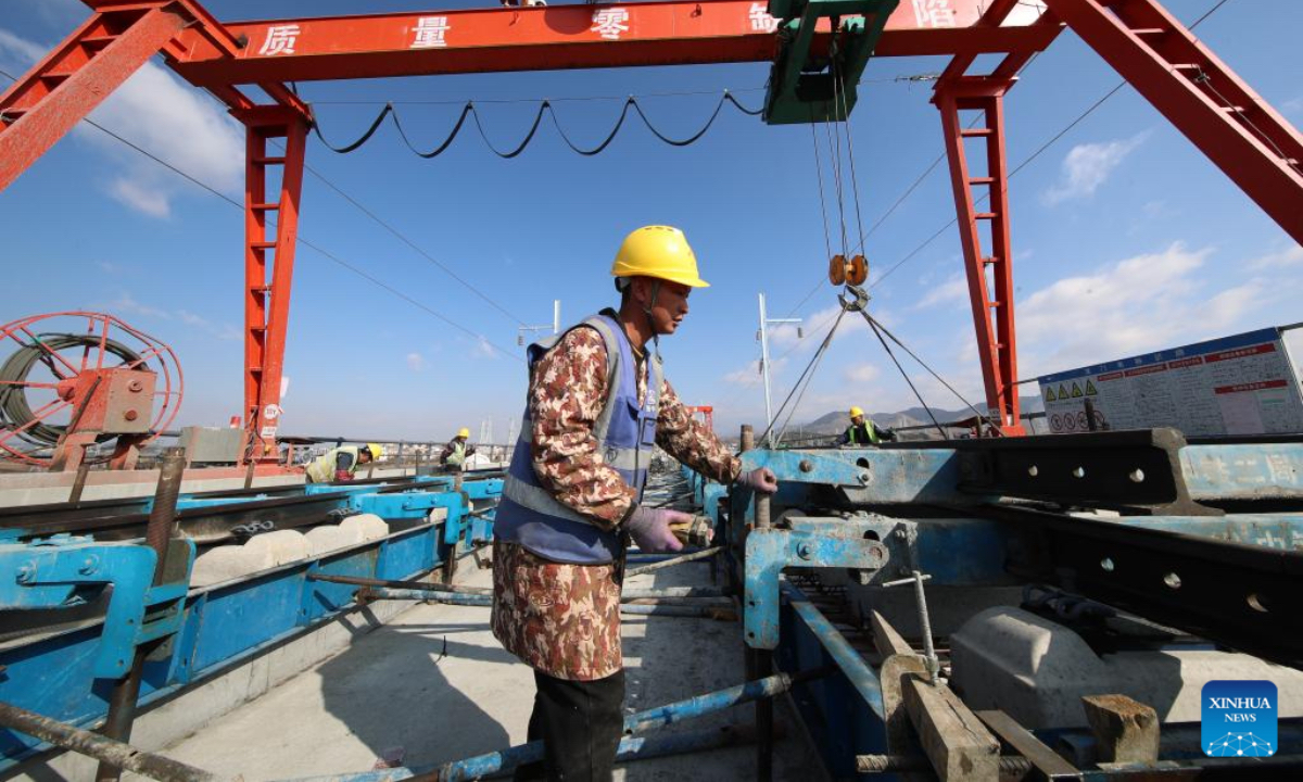 Constructors work at a construction site of Chongqing-Kunming High-Speed Railway in Zhaotong, southwest China's Yunnan Province, Dec. 7, 2025. (Photo by Zhang Guangyu/Xinhua)