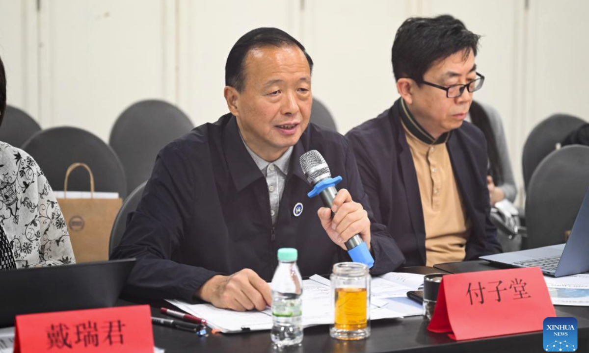 Fu Zitang (L), vice president of the China Society for Human Rights Studies and professor of Law at Southwest University of Political Science and Law, speaks during the International Symposium on Human Rights Protection in the Digital Era in Selangor state, Malaysia, Dec. 5, 2025. The symposium was held here on Friday, bringing together scholars, social organizations and media from both China and Malaysia. (Xinhua/Cheng Yiheng)