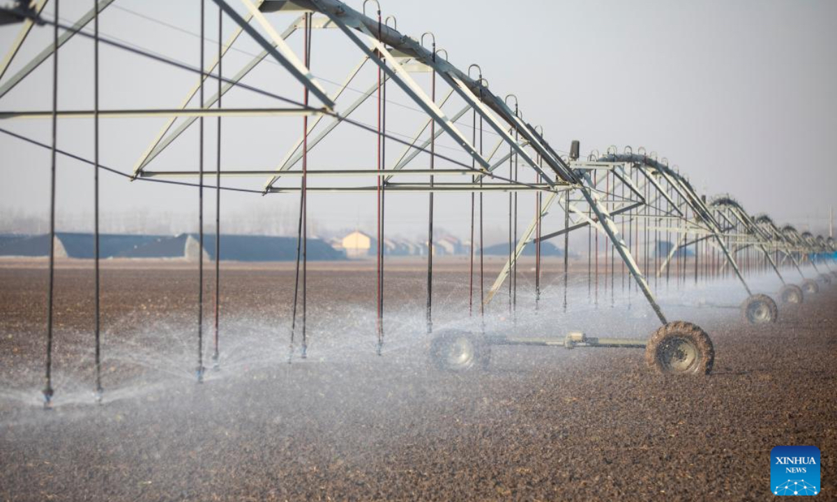 A drone photo taken on Dec. 6, 2025 shows sprinkler irrigation equipment working at a winter wheat field in Dongying City, east China's Shandong Province. As the solar term of Major Snow, also known as
