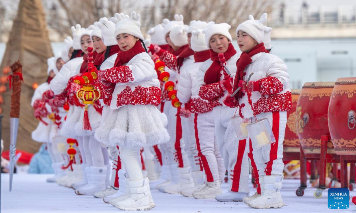Children perform during an ice collecting festival in Harbin, northeast China's Heilongjiang Province, Dec. 7, 2025. Marking the beginning of Harbin's ice collecting season, the sixth ice collecting festival kicked off here by the Songhua River on Sunday, attracting lots of people with ice collecting ceremony and folk custom experience activities. (Xinhua/Zhang Tao)