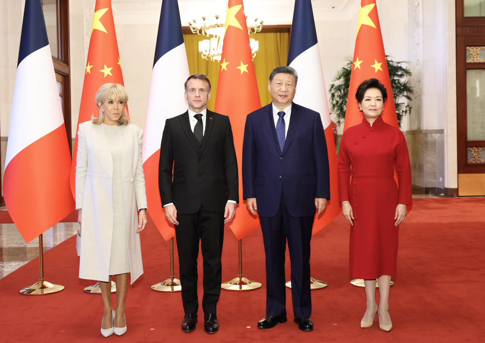 Chinese President Xi Jinping and his wife Peng Liyuan pose for photos with French President Emmanuel Macron and his wife Brigitte Macron ahead of talks between the two leaders in Beijing, capital of China, Dec. 4, 2025. Xi held talks with Macron, who is on a state visit to China, at the Great Hall of the People in Beijing on Thursday. (Xinhua/Huang Jingwen)