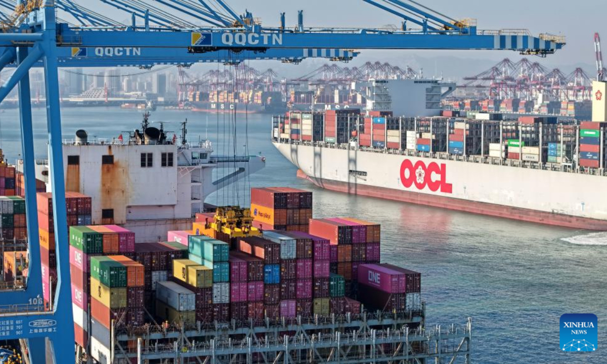 A drone photo taken on Dec. 4, 2025 shows cargo ships loading and unloading containers at the Qianwan Container Terminal of Qingdao Port in east China's Shandong Province. With nearly 240 foreign trade routes, Qingdao Port connects over 700 ports in more than 180 countries and regions worldwide. (Xinhua/Li Ziheng)