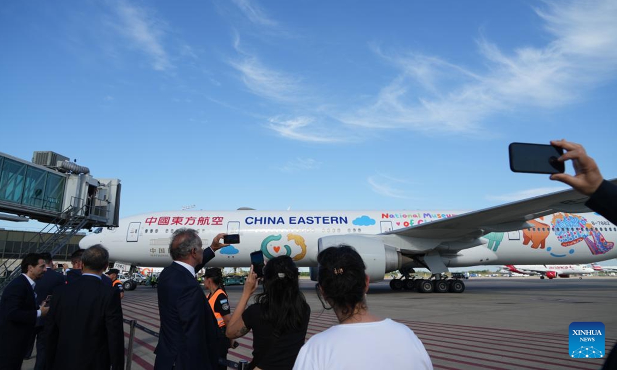 Staff welcome China Eastern Airlines' flight MU745, the first direct air route between China and Argentina, at Ezeiza International Airport in Buenos Aires, Argentina, Dec. 4, 2025. China Eastern Airlines' flight MU745 touched down in Buenos Aires, the capital of Argentina, on Thursday afternoon, marking the official launch of the first direct air route between China and Argentina, according to the carrier. (Xinhua/Zhang Duo)