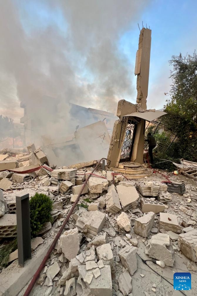 Photo taken on Dec. 4, 2025 shows buildings destroyed by Israeli airstrikes in the town of Jbaa, south Lebanon. Israeli airstrikes targeted buildings in four towns in southern Lebanon on Thursday afternoon, Lebanon's official National News Agency reported. According to a Lebanese army intelligence source, four buildings were destroyed and around 20 nearby homes were damaged. (Photo by Ali Hashisho/Xinhua)