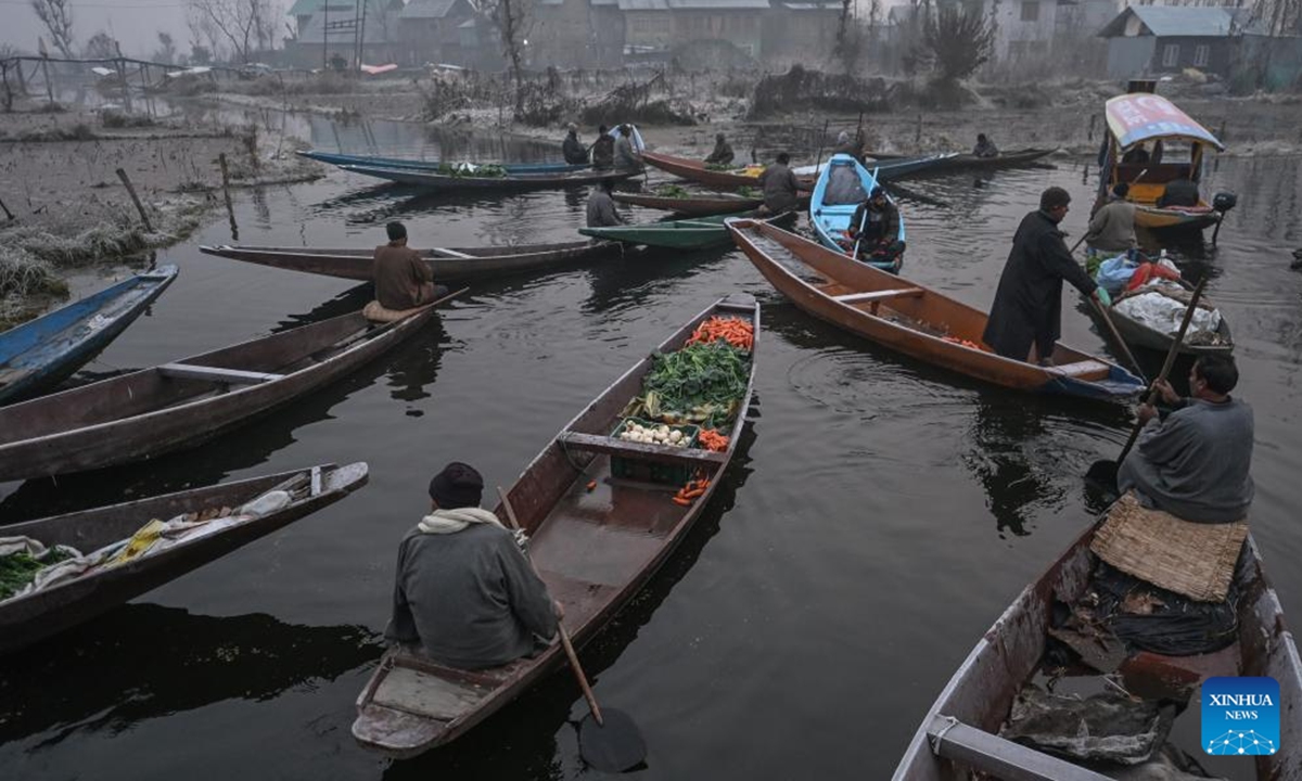 Vegetable vendors gather at a floating vegetable market in Srinagar, the summer capital of Indian-controlled Kashmir, Dec. 4, 2025. (Xinhua/Javed Dar)