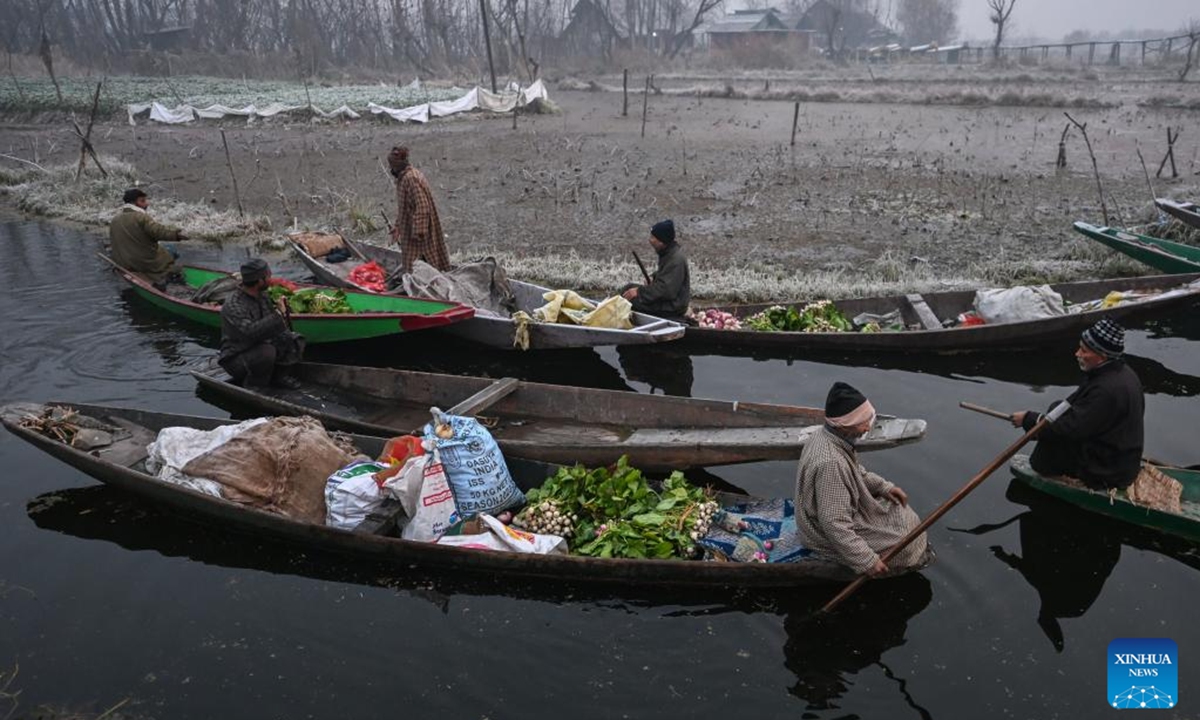 Vegetable vendors gather at a floating vegetable market in Srinagar, the summer capital of Indian-controlled Kashmir, Dec. 4, 2025. (Xinhua/Javed Dar)
