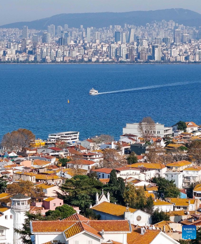 An aerial drone photo taken on Dec. 4, 2025 shows a boat sailing on the Sea of Marmara toward Buyukada Island in Istanbul, Türkiye. Buyukada Island, located in the Sea of Marmara and well known for its scenic beauty, is a popular getaway destination for locals and visitors. (Xinhua/Liu Lei)
