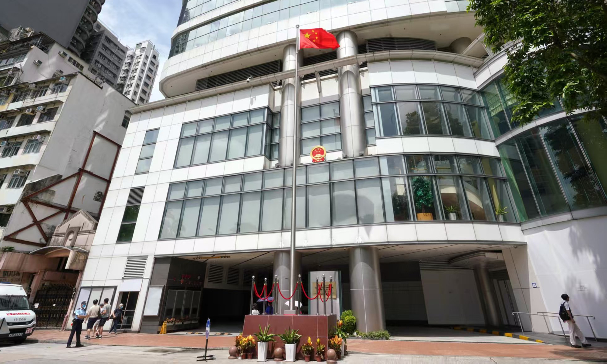 A national flag-raising ceremony marks the official inauguration of the Office for Safeguarding National Security of the Central People’s Government in the Hong Kong SAR on July 8, 2020, as the five-star red flag flies high outside the newly unveiled headquarters. Photo: VCG