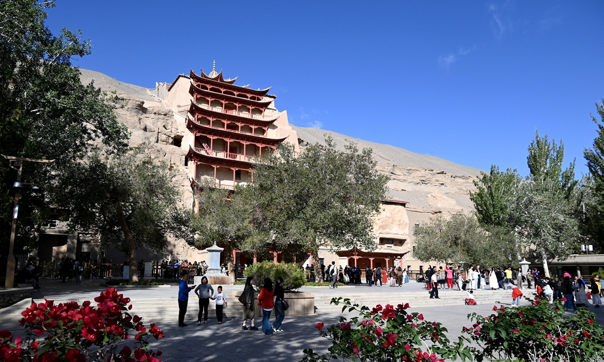 People visit the Mogao Caves in Dunhuang on October 2, 2025. Photo: VCG