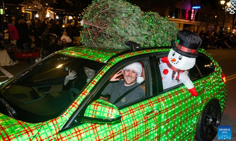 People participate in a Christmas parade in Pleasanton, California, the United States, Dec. 6, 2025. (Photo by Ziyu Julian Zhu/Xinhua)