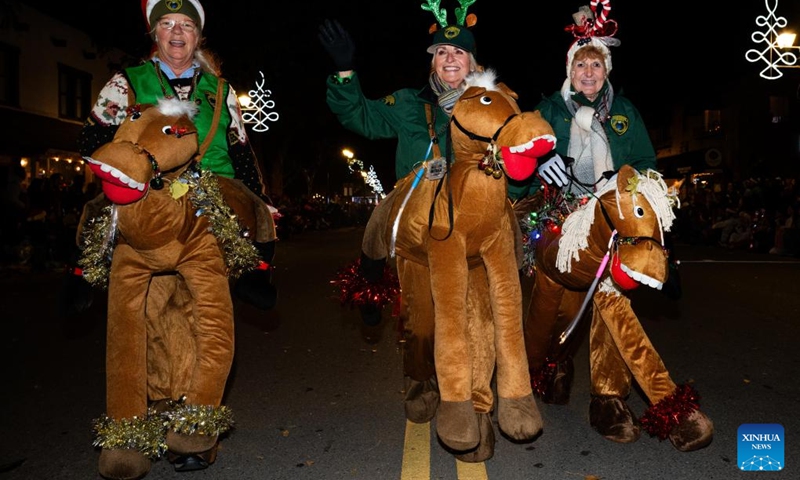 People participate in a Christmas parade in Pleasanton, California, the United States, Dec. 6, 2025. (Photo by Ziyu Julian Zhu/Xinhua)