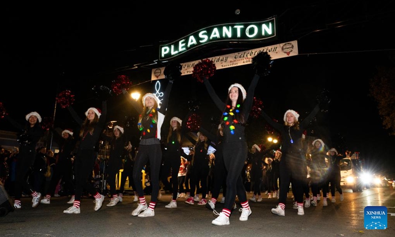 People participate in a Christmas parade in Pleasanton, California, the United States, Dec. 6, 2025. (Photo by Ziyu Julian Zhu/Xinhua)