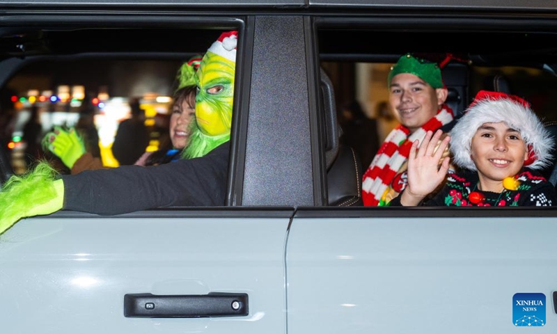 People participate in a Christmas parade in Pleasanton, California, the United States, Dec. 6, 2025. (Photo by Ziyu Julian Zhu/Xinhua)