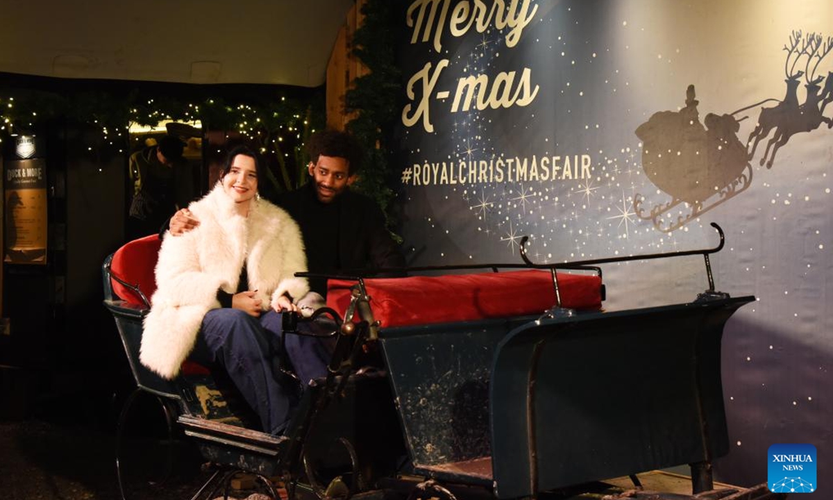 People pose for photos at the Royal Christmas Fair in The Hague, the Netherlands, Dec. 6, 2025. Kicking off here on Dec. 4, the fair will run until Dec. 23. (Xinhua/Shao Haijun)
