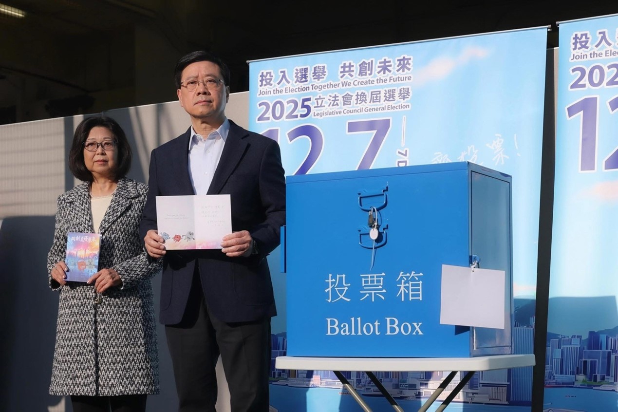 The 8th-term Legislative Council Election of the Hong Kong Special Administrative Region (HKSAR) is held on December 7, 2025. The HKSAR Chief Executive John Lee, accompanied with his wife Janet Lee Lam Lai-sim, cast their ballots at the Raimondi College polling station. Photo: Courtesy of Lee's social media 