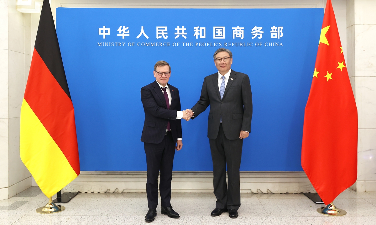 China's Commerce Minister Wang Wentao shakes hand with German Foreign Minister Johann Wadephul in Beijing on December 8, 2025. Photo: Official website of China's Ministry of Commerce 