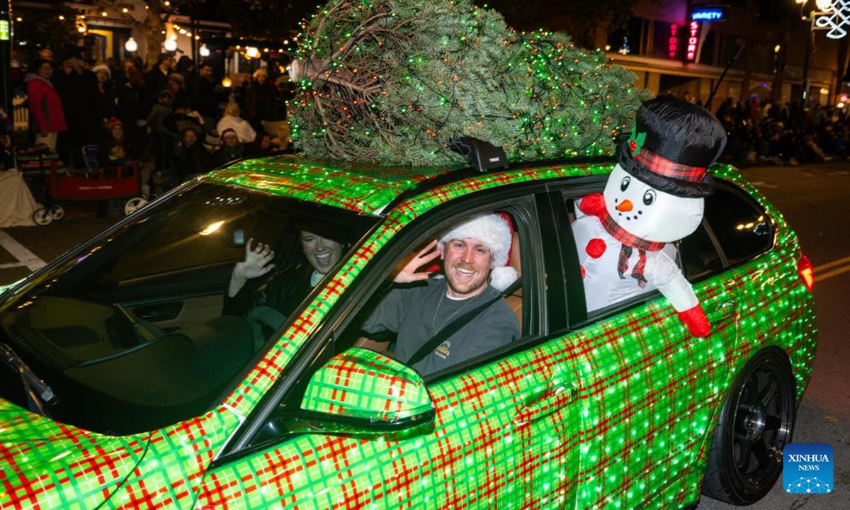 People participate in a Christmas parade in Pleasanton, California, the United States, Dec. 6, 2025. (Photo by Ziyu Julian Zhu/Xinhua)