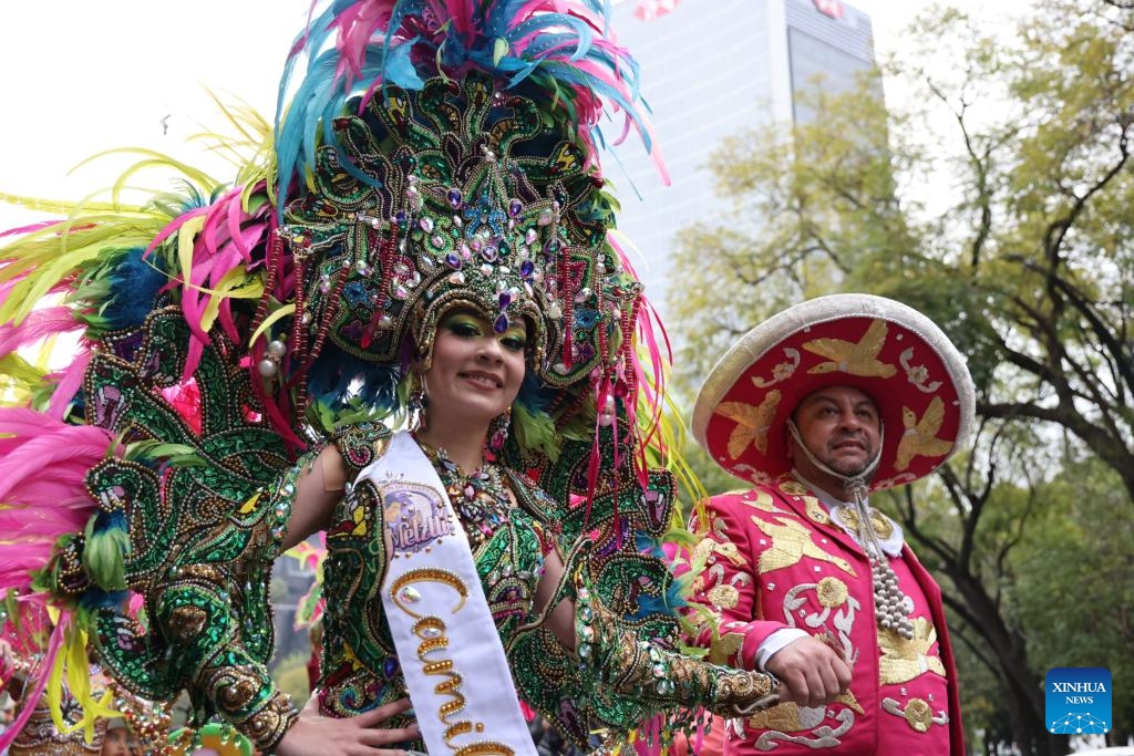 Performers march in costumes during the Villa-Zapata carnival in Mexico City, Mexico, on Dec. 6, 2025. The 11th Villa-Zapata carnival was hosted in Mexico City on Saturday. Folkloric dances, traditional music, and street processions were seen along the Paseo de la Reforma avenue during the event, promoting traditional Mexican culture while paying tribute to revolutionary leaders Emiliano Zapata and Francisco Villa in the Mexican Revolution of 1910-1920. (Xinhua/Li Mengxin)
