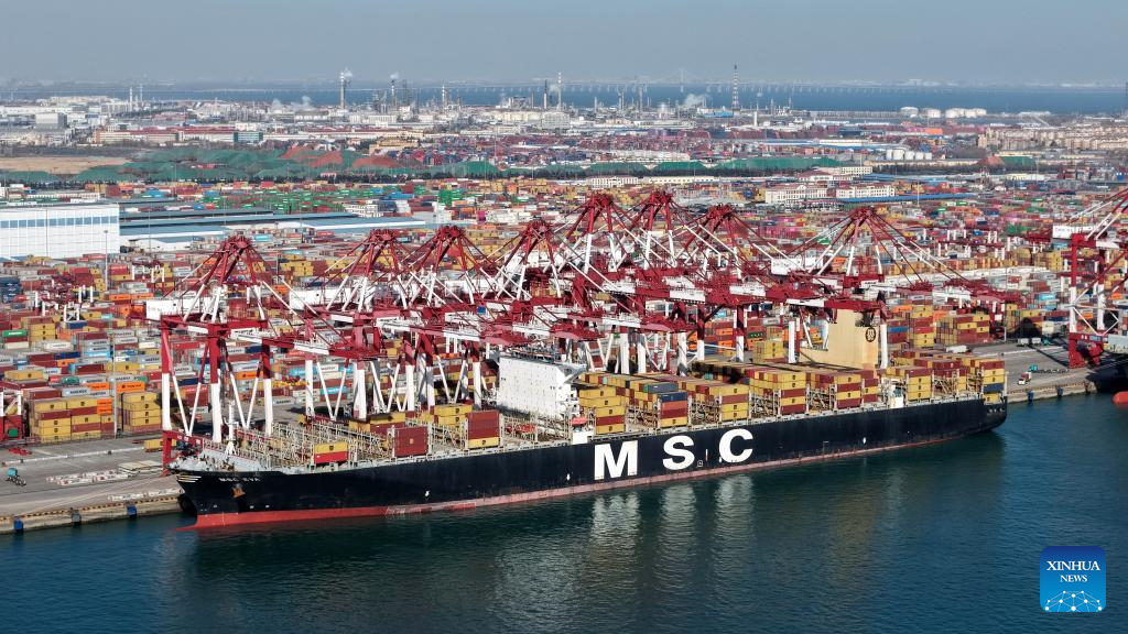 A drone photo taken on Dec. 8, 2025 shows a cargo ship at a container terminal of Qingdao Port in Qingdao, east China's Shandong Province. The cargo throughput of Qingdao Port in 2025 surpassed 700 million tonnes on Monday, reaching this milestone 15 days earlier compared to 2024.
Qingdao Port has continuously expanded its international logistics network, with nearly 240 routes connecting over 700 ports in over 180 countries and regions worldwide. (Xinhua/Li Ziheng)