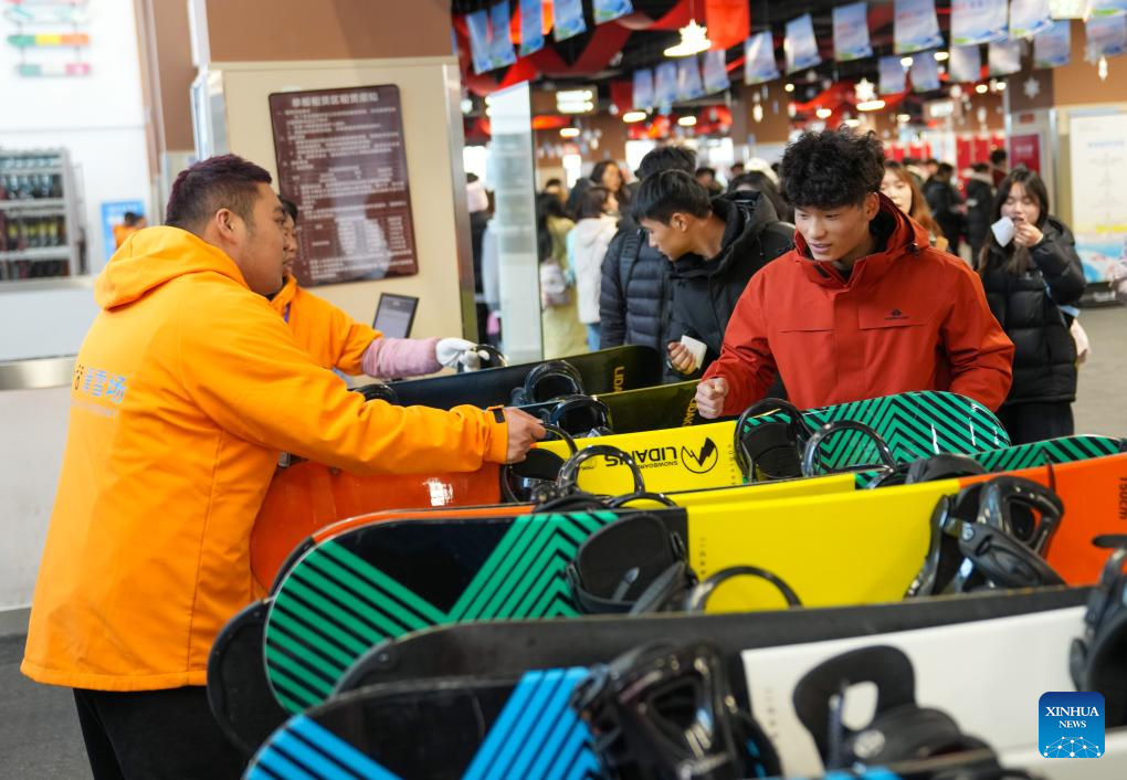 Tourists pick up skiing equipment at Qiangrengu ski resort in Wenchuan County, Aba Tibetan and Qiang Autonomous Prefecture, southwest China's Sichuan Province, Dec. 8, 2025. The 2025 Sichuan Winter Tourism Season kicked off here on Monday. Sichuan has launched four major tourism routes and more than 5,000 winter cultural and tourism activities to enrich visitors' winter travel experience. (Xinhua/Jiang Hongjing)