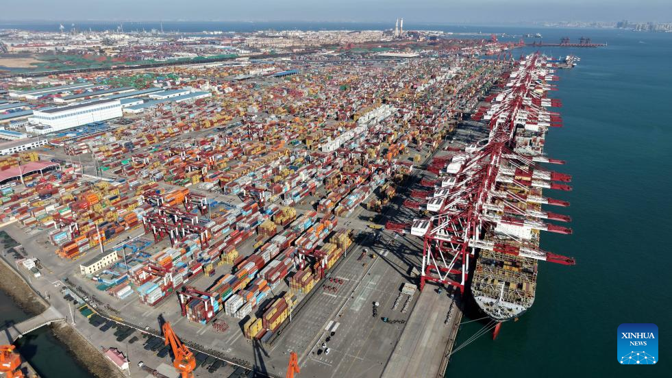 An aerial drone photo taken on Dec. 8, 2025 shows a view of Qingdao Port in Qingdao, east China's Shandong Province. The cargo throughput of Qingdao Port in 2025 surpassed 700 million tonnes on Monday, reaching this milestone 15 days earlier compared to 2024.
Qingdao Port has continuously expanded its international logistics network, with nearly 240 routes connecting over 700 ports in over 180 countries and regions worldwide. (Xinhua/Li Ziheng)